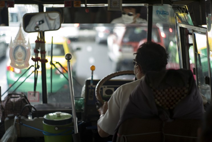 Bus driver in heavy Bangkok traffic